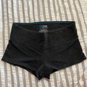 TNA low rise booty shorts. dark grey. size women’s S